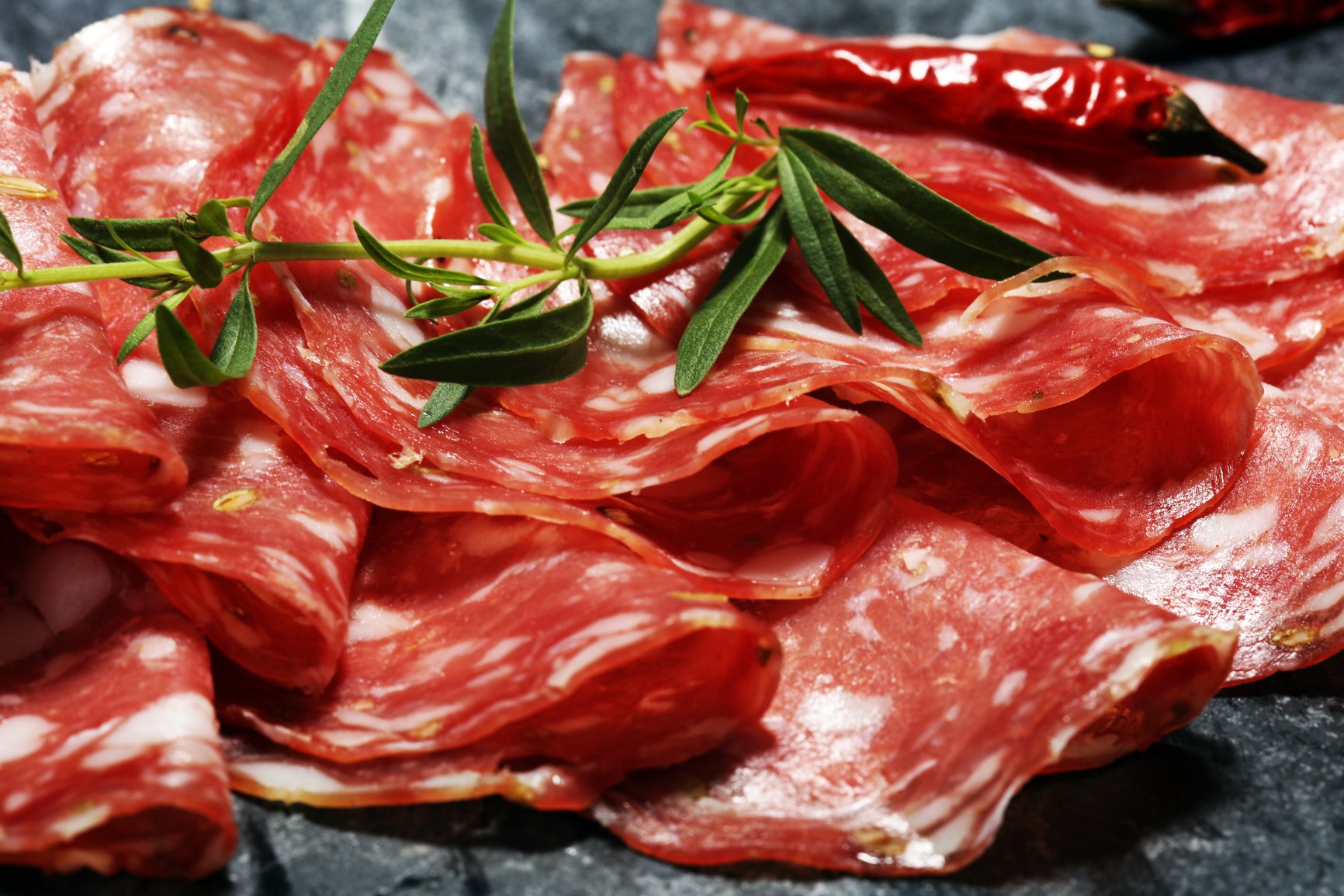 thinly sliced salami . delicious snack rustic salami